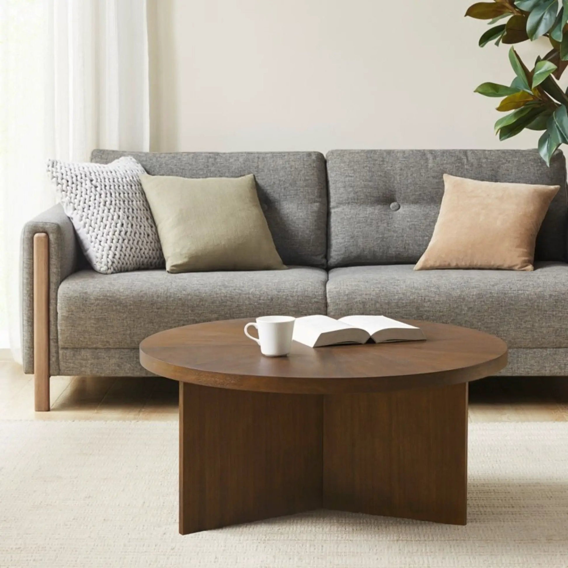 Round coffee table with solid veneer top in dark wood by Unique Piece Furniture on Tampa Home & Garden Store