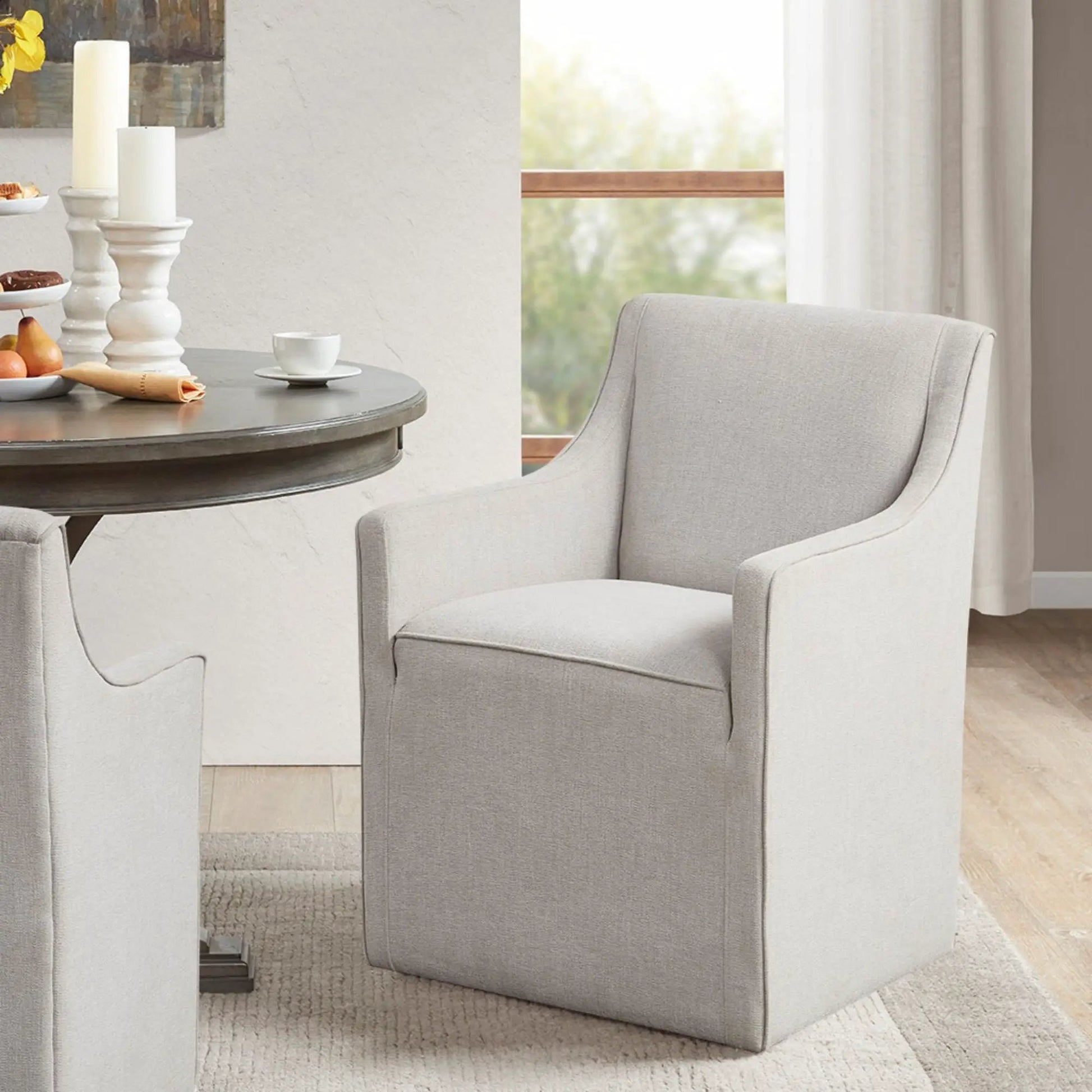 Pair of traditional skirted dining arm chairs in light gray fabric by Unique Piece Furniture on Tampa Home & Garden Store