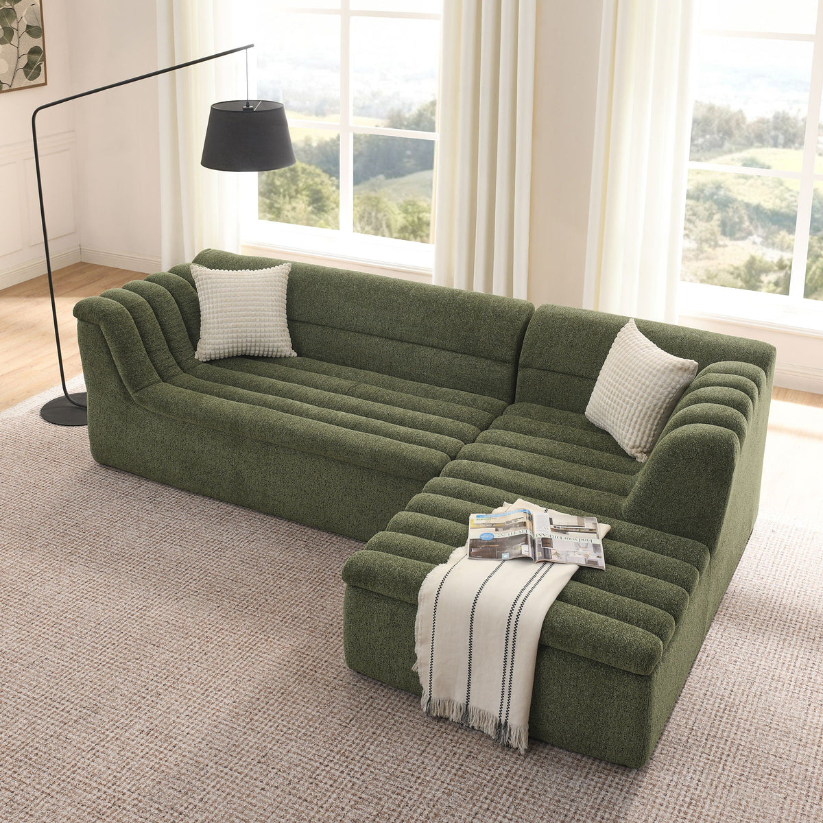 Upholstered L-shaped modular sectional sofa with chaise in green textured fabric, wave-shaped armrest on Tampa Home & Garden Store