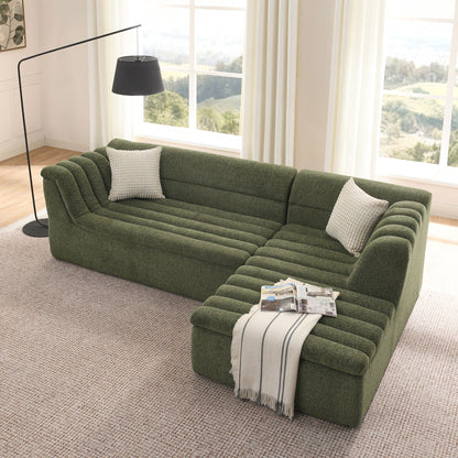 Upholstered L-shaped modular sectional sofa with chaise in green textured fabric, wave-shaped armrest on Tampa Home & Garden Store