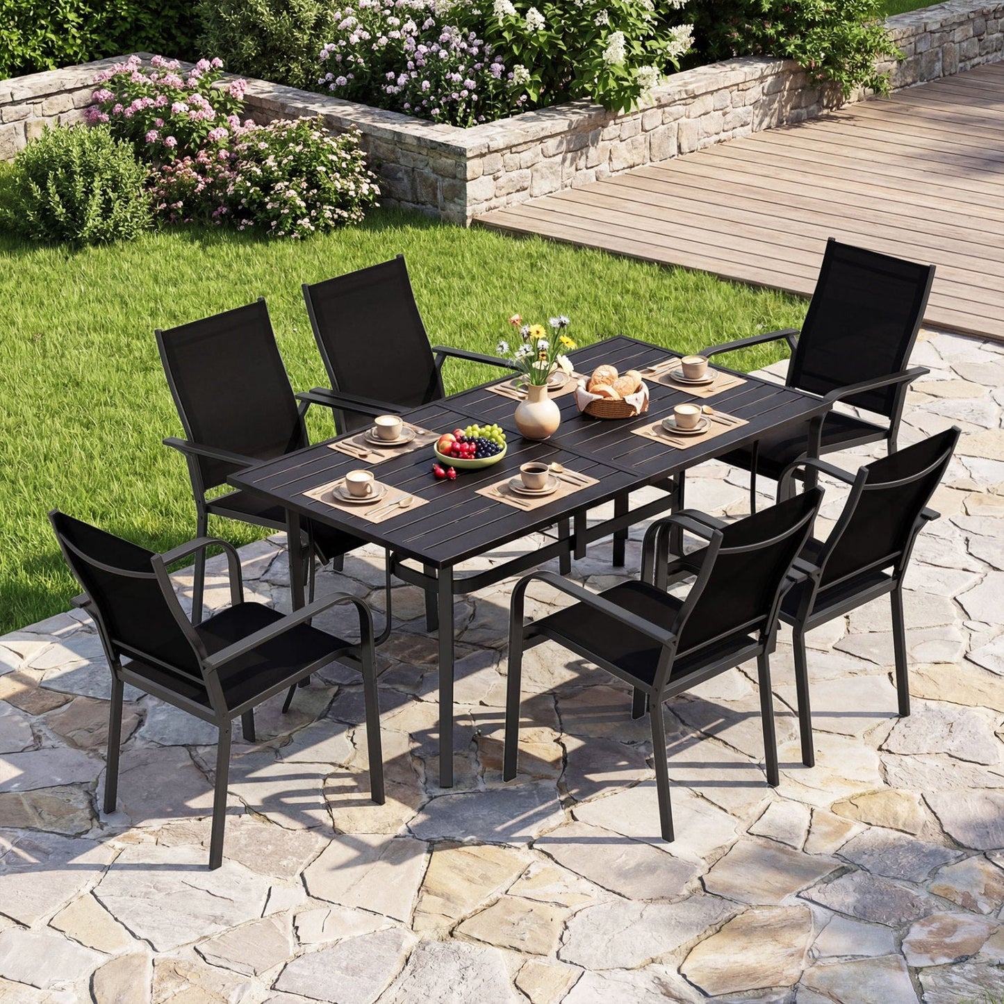 63x33 inch rectangle metal patio dining table for 6 in black with 6 chairs on stone patio on Tampa Home & Garden Store