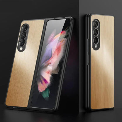 Galaxy Flip Metal Cover Phone Case with brushed gold back and black frame, triple-camera cutout on Tampa Home & Garden Store
