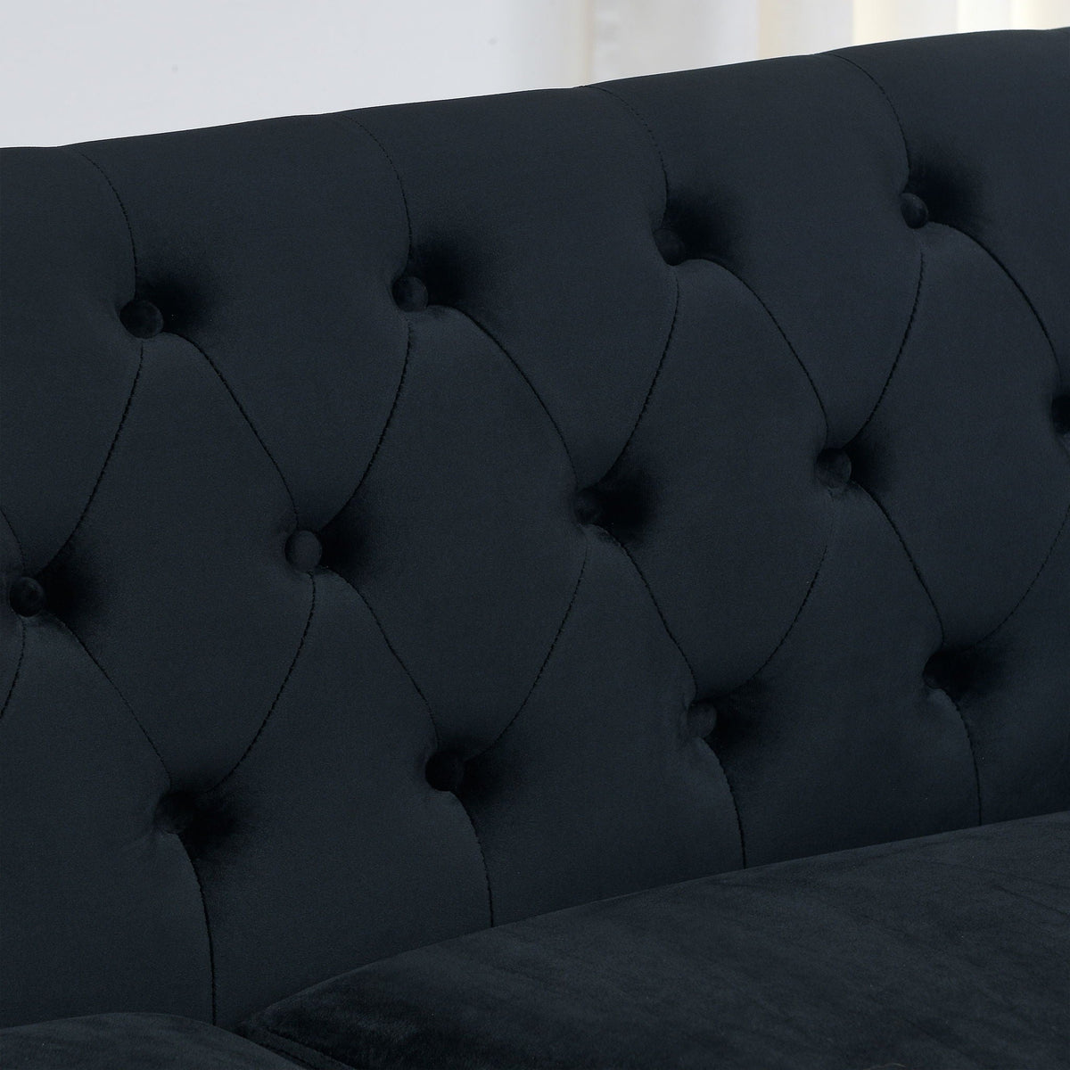 Modern Chesterfield sofa with diamond-tufted backrest in dark navy fabric on Tampa Home & Garden Store