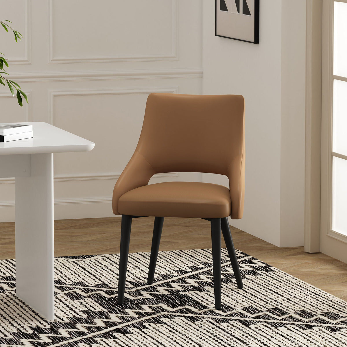 Tremont dining chair with steel frame in tan faux leather and black legs by HouseOfZazla on Tampa Home & Garden Store