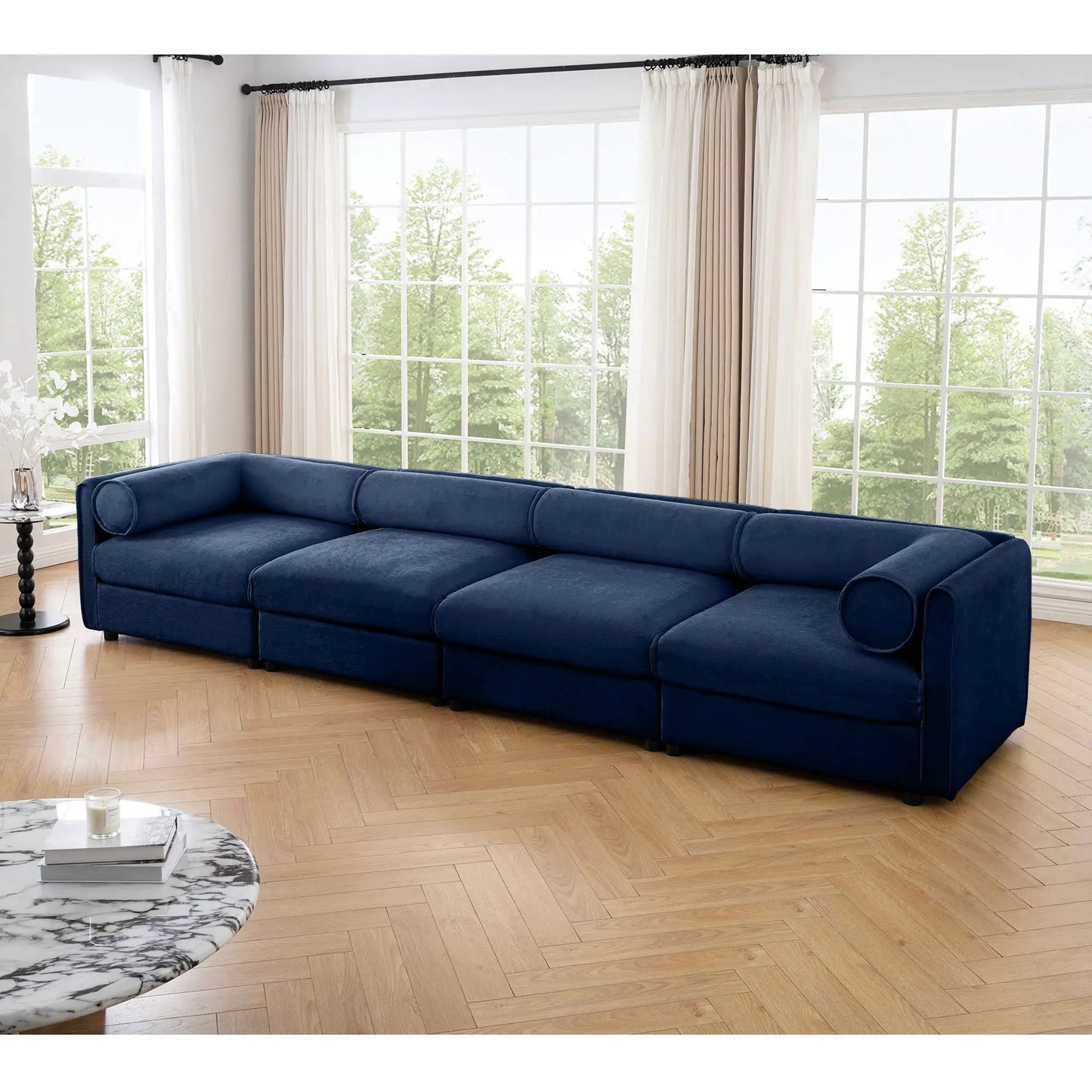 Blue velvet stationary sofa with storage seat and cylindrical backrest bolsters on Tampa Home & Garden Store