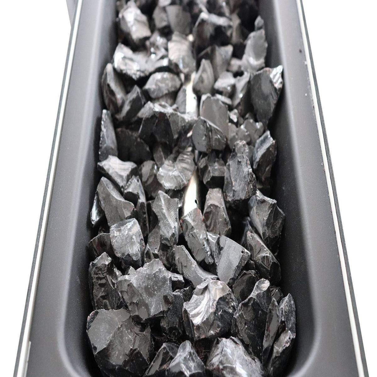 Outdoor Fire Pit Table lava rocks in a black steel fire pit channel on Tampa Home & Garden Store