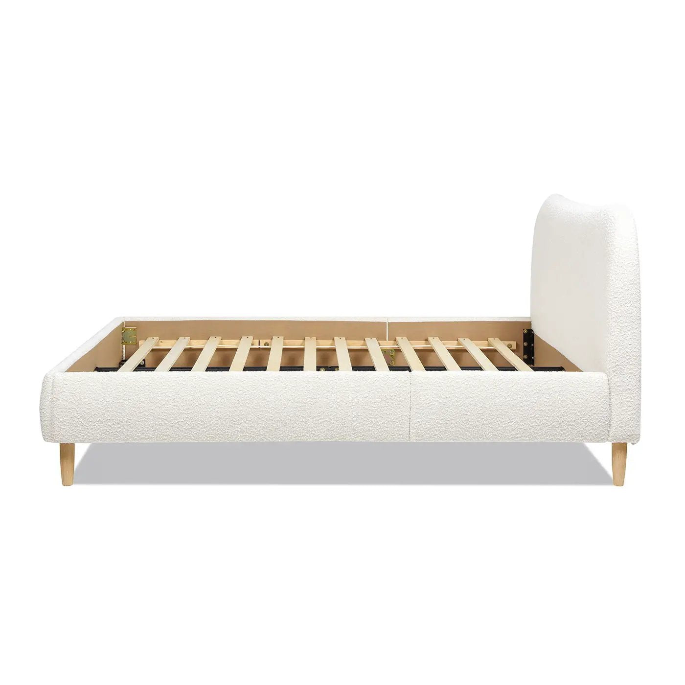 Roman curved headboard upholstered platform bed in ivory fabric with wood legs on Tampa Home & Garden Store