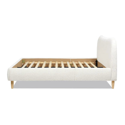 Roman curved headboard upholstered platform bed in ivory fabric with wood legs on Tampa Home & Garden Store