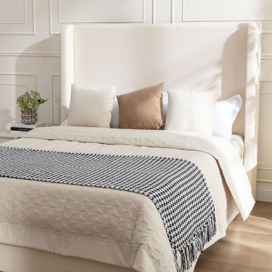 Harper tall headboard upholstered bed in cream fabric by HouseOfZazla with neutral pillows on Tampa Home & Garden Store