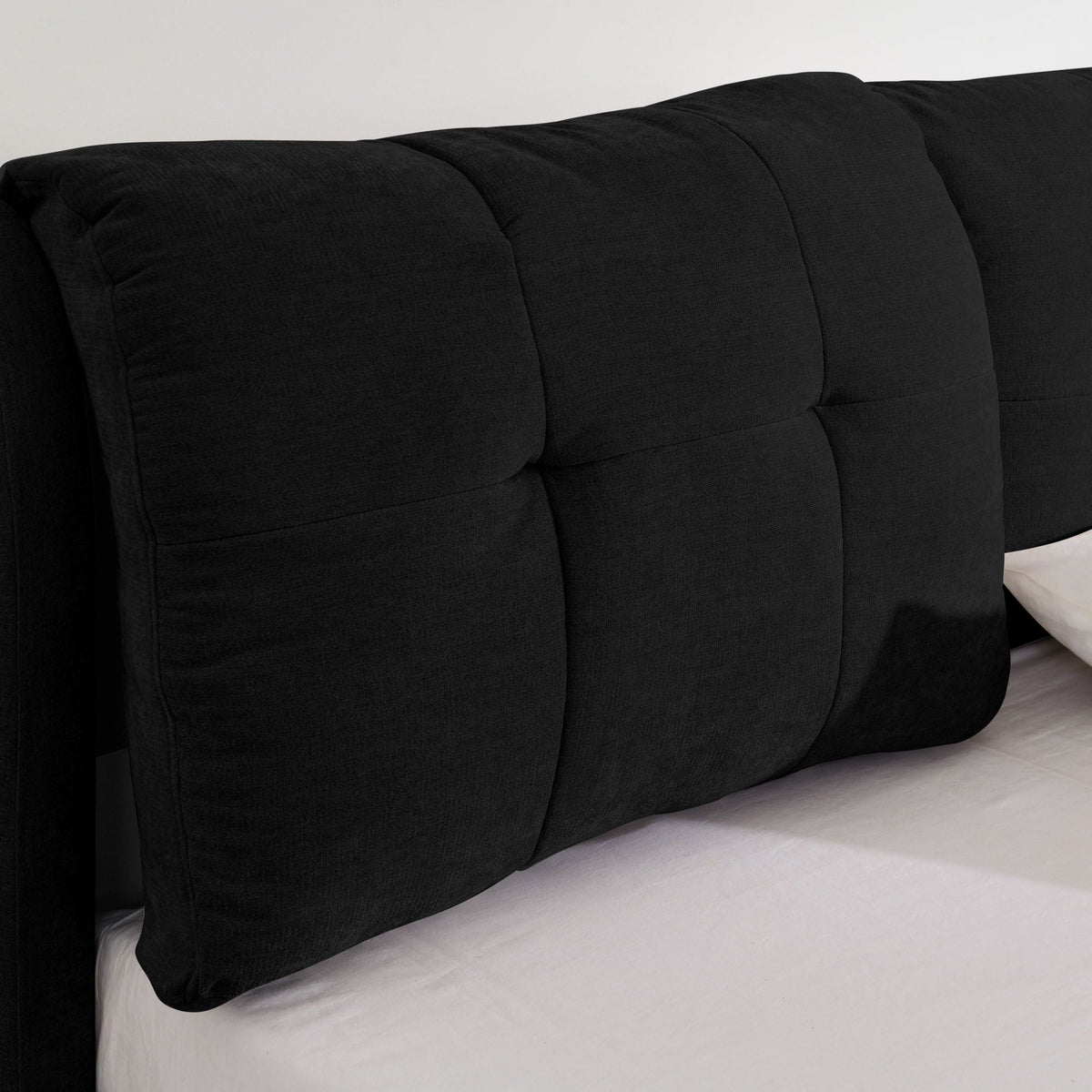 Storage upholstered platform bed with integrated headboard in black fabric, tufted panels on Tampa Home & Garden Store