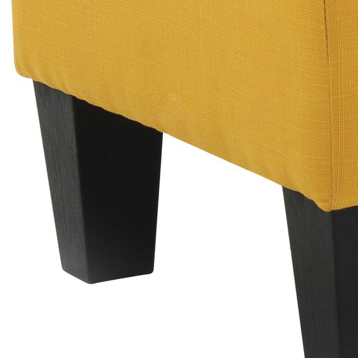 Upholstered ottoman in mustard yellow fabric with black block legs on Tampa Home & Garden Store