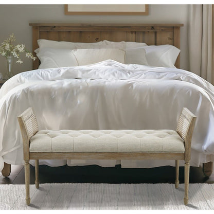 Natural wood framed upholstered bench with arms and tufted beige seat on Tampa Home & Garden Store