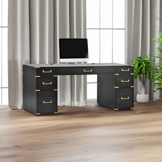 70-inch dark wood executive desk with gold hardware, dual pedestal drawers and a computer monitor on top on Tampa Home & Garden Store
