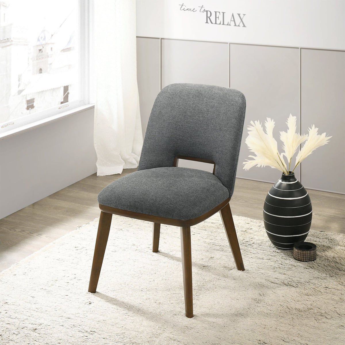 Modern dining chair with gray upholstery and walnut wood legs on Tampa Home & Garden Store