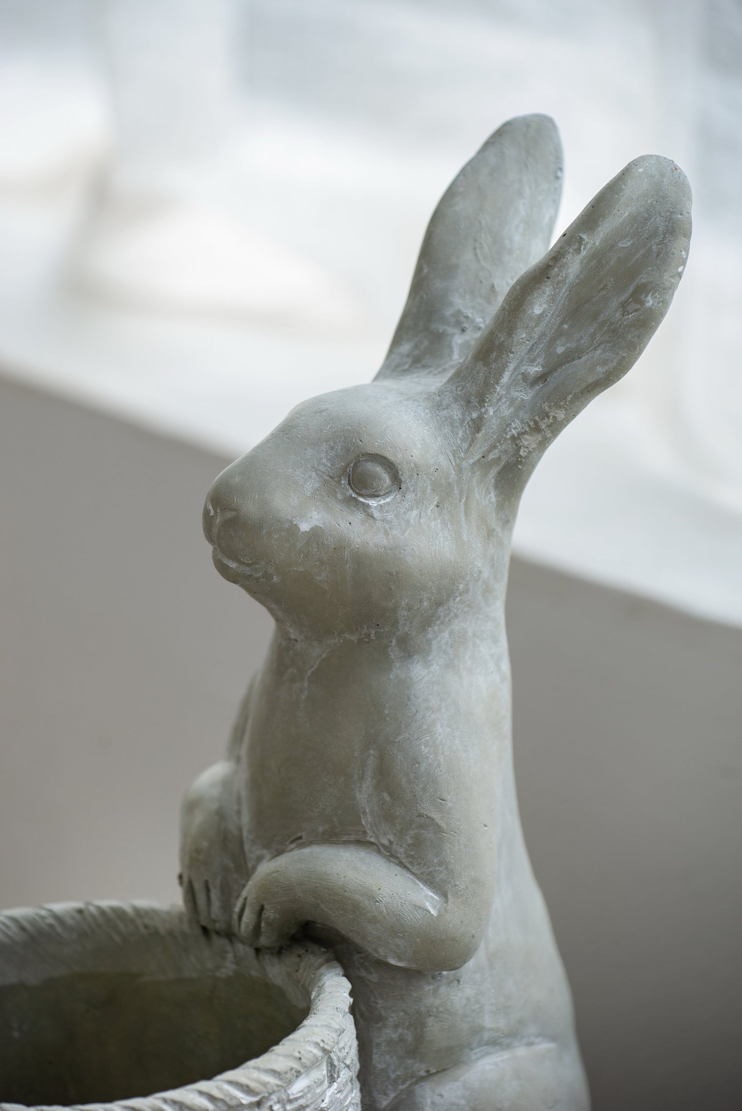 Meridian Trade Co Decorative Cement Rabbit Planter with woven basket, gray finish on Tampa Home & Garden Store