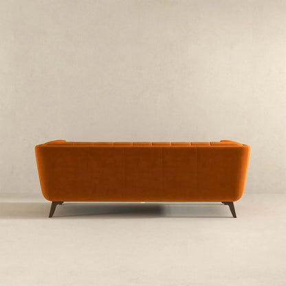 Addison mid-century tufted sofa in burnt orange upholstery with tapered wood legs on Tampa Home & Garden Store