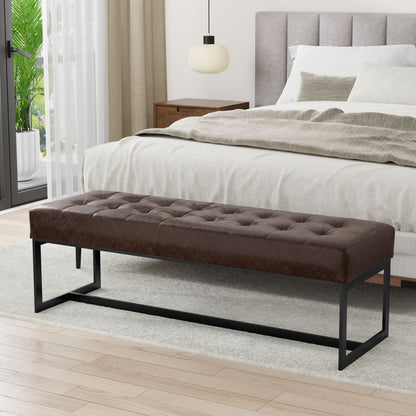 Genuine brown leather tufted ottoman bench with black metal legs at foot of bed on Tampa Home & Garden Store