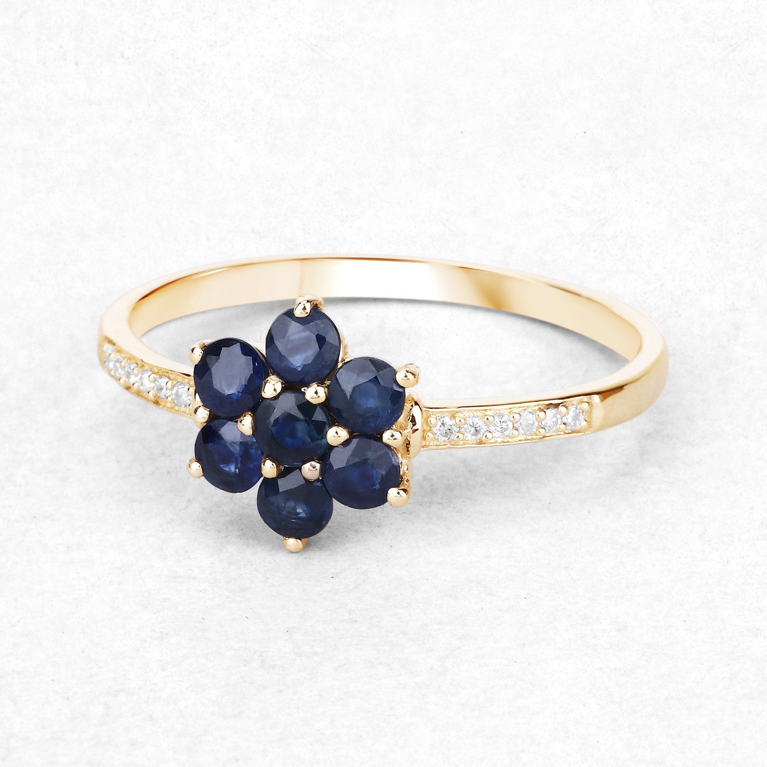 Ring, 10K yellow gold with a flower cluster of deep blue sapphires and white diamonds on band on Tampa Home & Garden Store