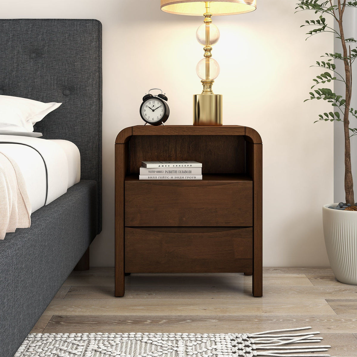 Brown solid-wood 2-drawer nightstand with brass lamp, clock and books on bedside shelf on Tampa Home & Garden Store