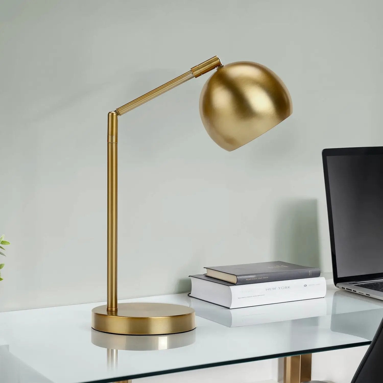 Table lamp, contemporary gold finish with adjustable arm on glass desk on Tampa Home & Garden Store
