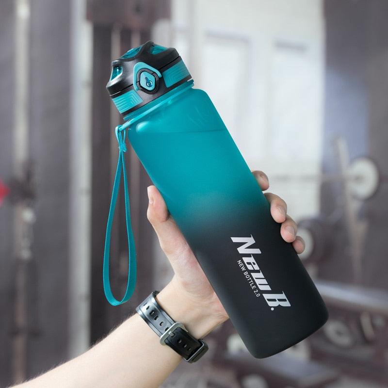 Stevvex stainless steel vacuum insulated water bottle gradient teal to black with teal lanyard on Tampa Home & Garden Store