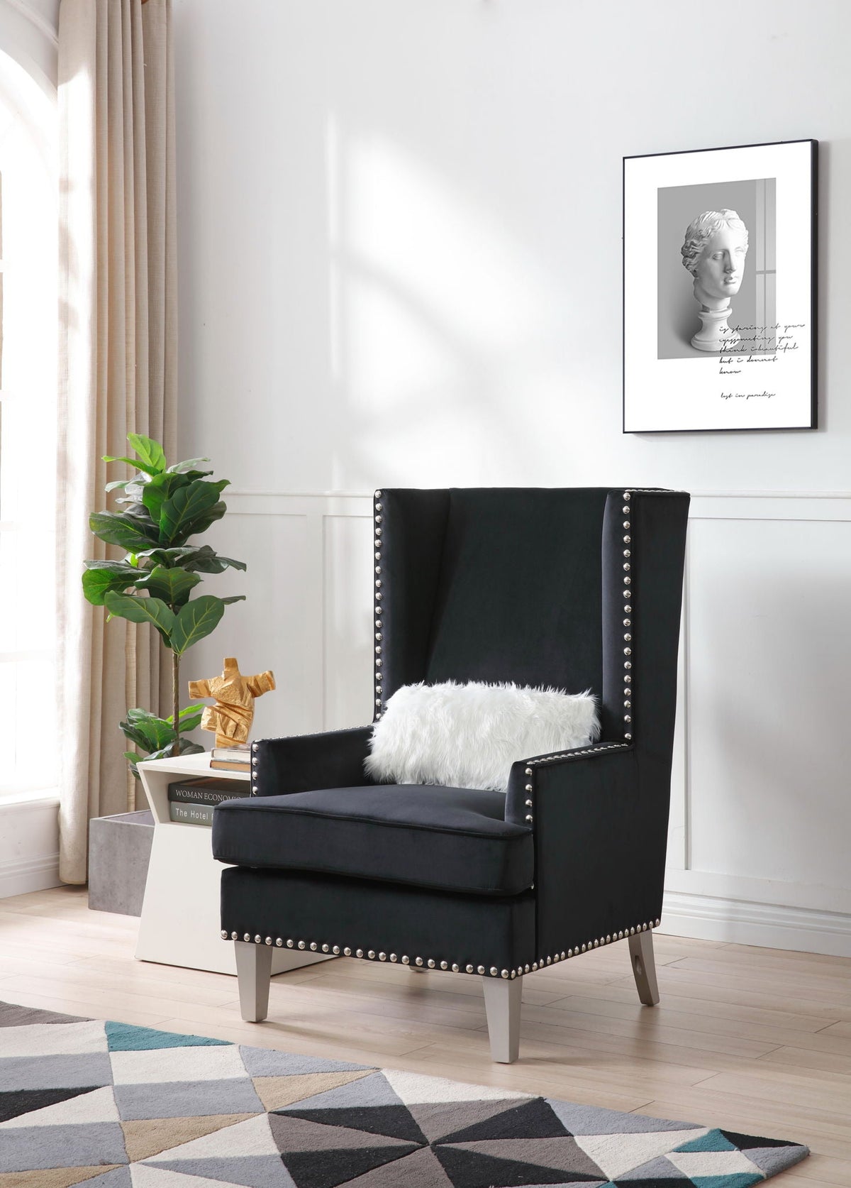 Traditional accent arm chair in black upholstery with deep tufting and nailhead trim on Tampa Home & Garden Store
