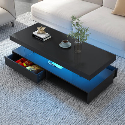 LED coffee table with 2 drawers; black exterior with blue interior, plant and books on top on Tampa Home & Garden Store