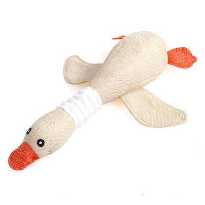 Beige duck-shaped plush dog toy with orange beak, white neck band, sound toy on Tampa Home & Garden Store