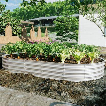 Round galvanized raised garden bed kit filled with soil and leafy greens on Tampa Home & Garden Store