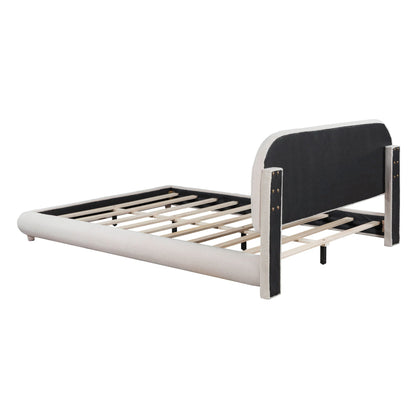 Upholstered platform bed with thick light-gray frame and curved dark-gray headboard panels, exposed wooden slats on Tampa Home & Garden Store
