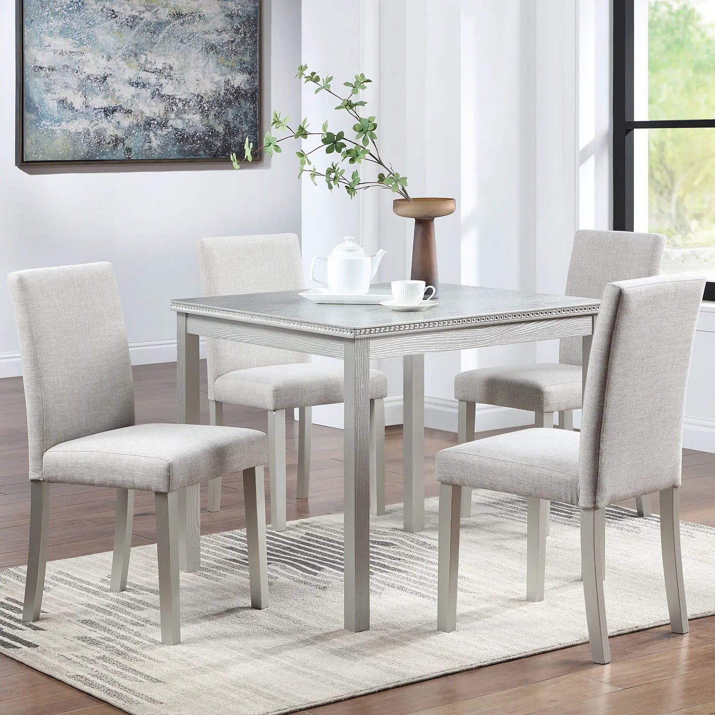 5-piece dining set with crystal-edged table and four upholstered grey chairs on Tampa Home & Garden Store