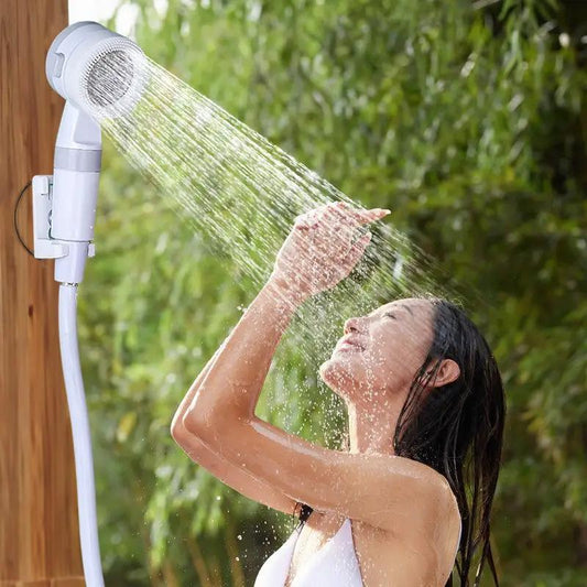 Rechargeable camping shower pump with display, white portable shower head and hose on Tampa Home & Garden Store
