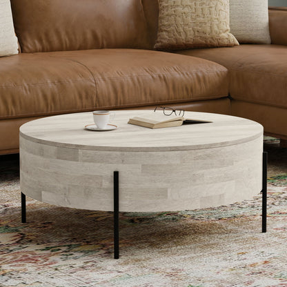 Stylish coffee table in solid mango wood with a round light gray top and black metal legs on Tampa Home & Garden Store