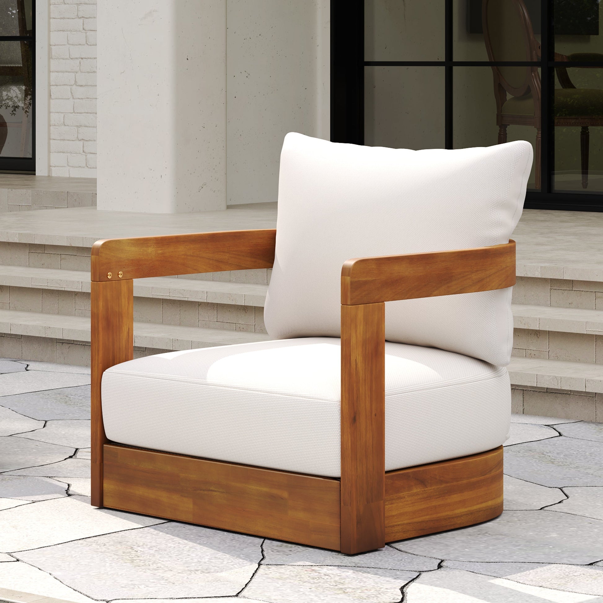 Premium Acacia Wood Outdoor Club Chair with white cushions and wood frame on a stone patio on Tampa Home & Garden Store
