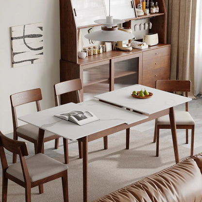 Dining table by Unique Piece Furniture with white top and diagonal wooden legs seats 6–8 on Tampa Home & Garden Store