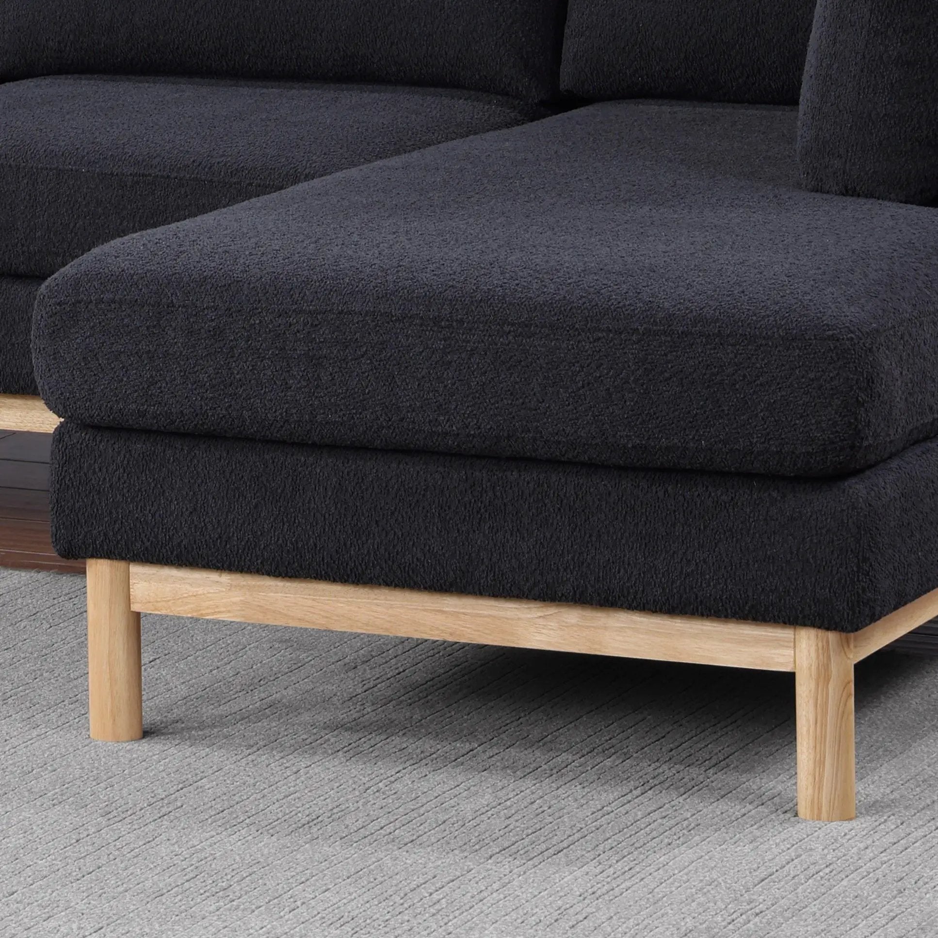 Hallie sherpa chaise sofa in black fabric with wood legs on Tampa Home & Garden Store
