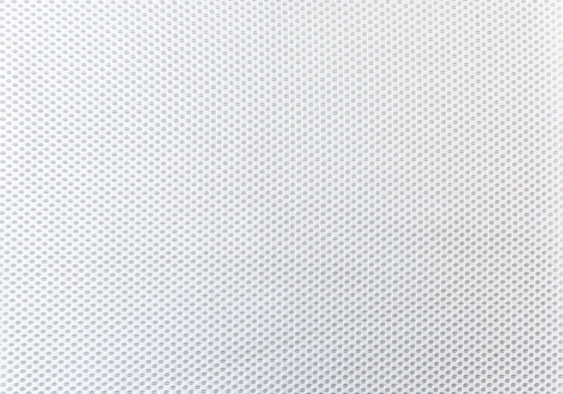 Office chair white perforated mesh upholstery close-up on Tampa Home & Garden Store