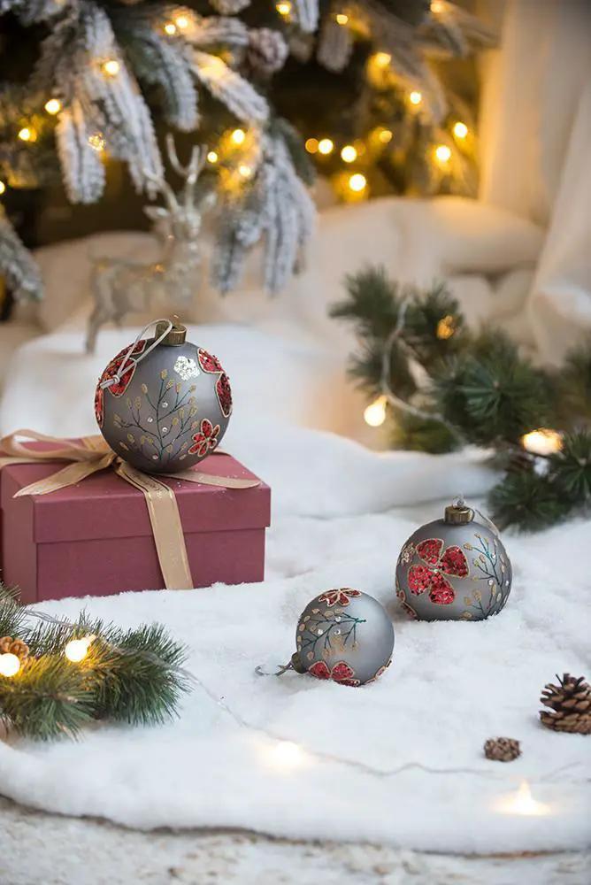 Glass hanging ball ornaments in gray-blue with red floral accents, set of 3 on snowy scene on Tampa Home & Garden Store
