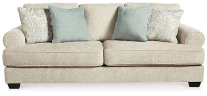 Monaghan Sofa Sandstone stationary sofa with two teal cushions by Unique Piece Furniture on Tampa Home & Garden Store