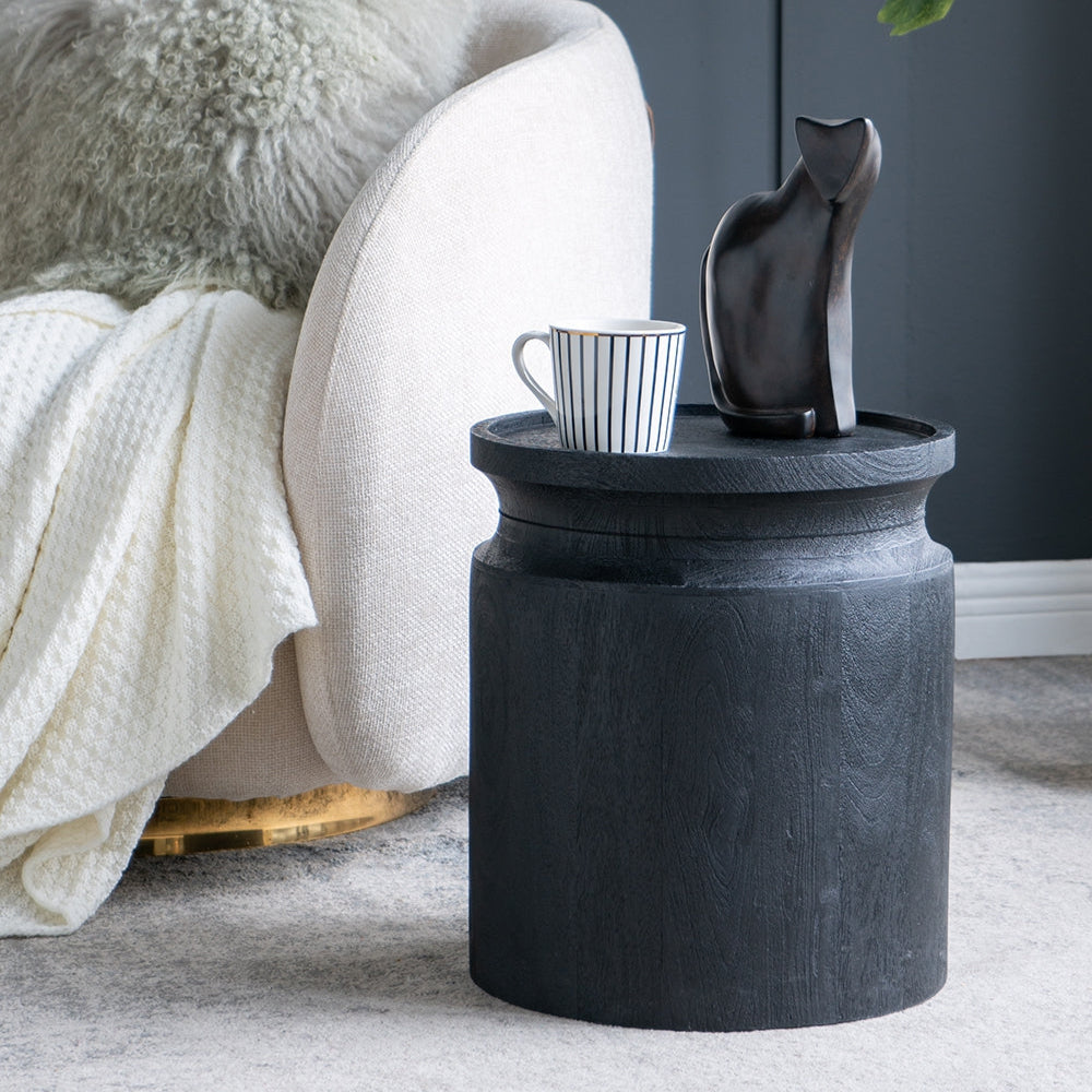 Black wooden cylinder side table by HouseOfZazla with round top and wood grain in a living space on Tampa Home & Garden Store