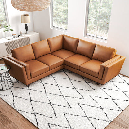 Erman Corner Sofa tan leather sectional by HouseOfZazla in a bright living room on Tampa Home & Garden Store