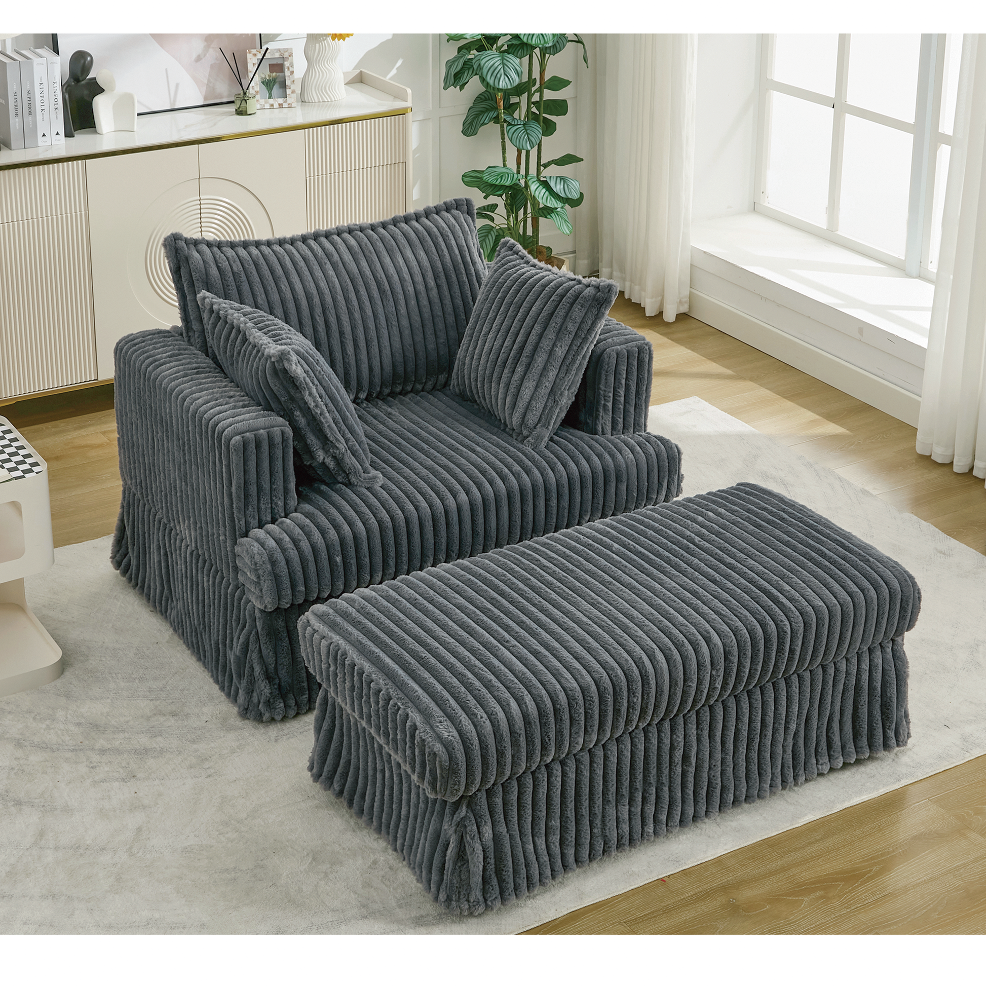 Oversized dark gray corduroy chaise lounge with ottoman by HouseOfZazla in a living room on Tampa Home & Garden Store