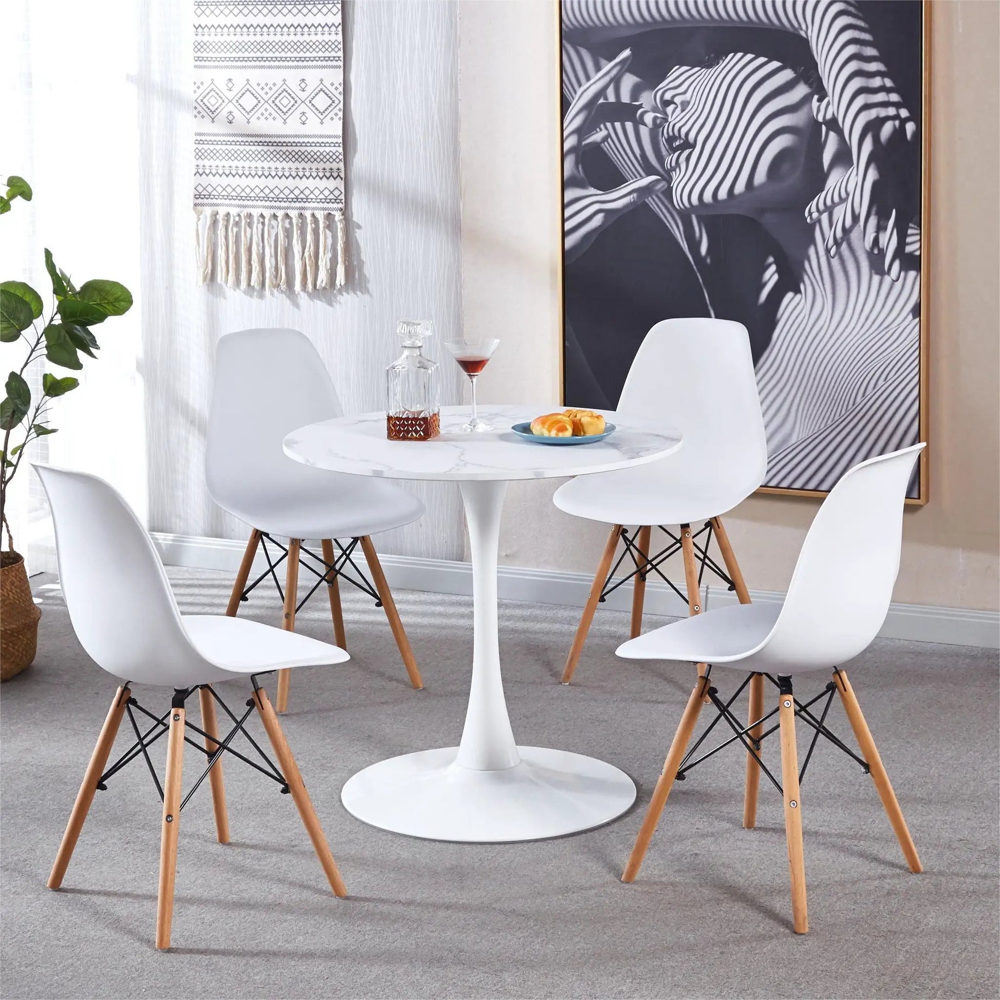 Tulip Special Dining Table with white marble top and white molded chairs on Tampa Home & Garden Store