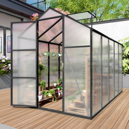 Windproof greenhouse with raised base, black frame and polycarbonate panels, interior plants on Tampa Home & Garden Store