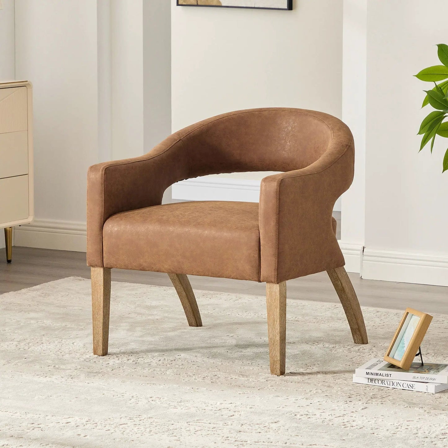 Upholstered open-back armchair in brown leather-look fabric with weathered rubberwood legs on Tampa Home & Garden Store