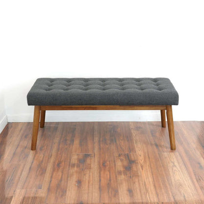 Modern bench with gray velvet upholstery, tufted top and wooden legs on Tampa Home & Garden Store