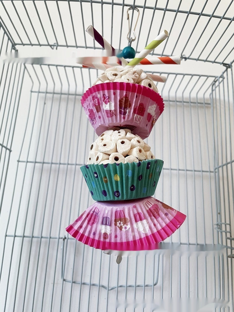 Parrot toy edible shredding bird toy by Sell My Stuff with stacked pink teal cupcake wrappers on Tampa Home & Garden Store