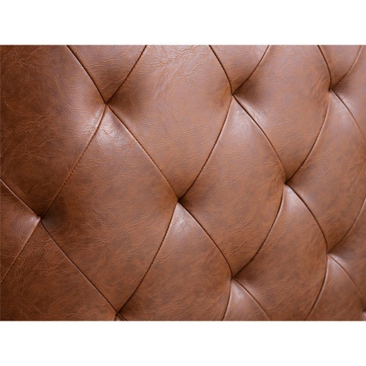 Swivel chair with light brown tufted leather upholstery featuring diamond stitching on Tampa Home & Garden Store