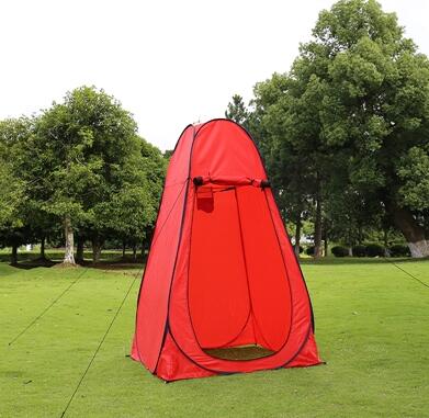 Red portable privacy tent shelter for camping on grass with open doorway on Tampa Home & Garden Store