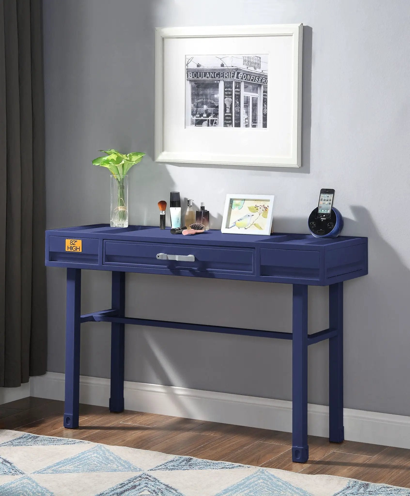 Cargo vanity desk with storage, makeup items, plant in glass vase, and framed art on Tampa Home & Garden Store